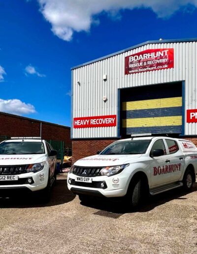 two white pick up trucks