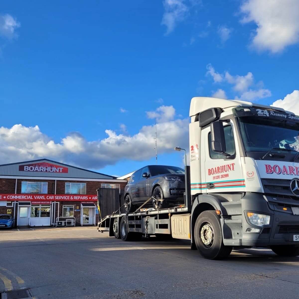 White Iveco truck recovered a white classic car